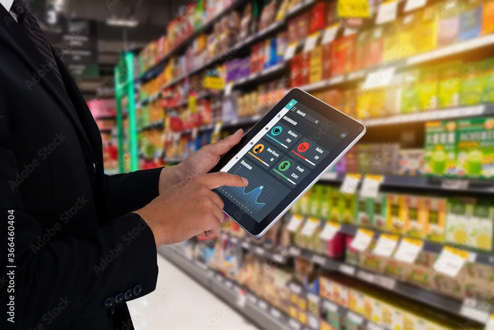 A retail employee reviewing inventory